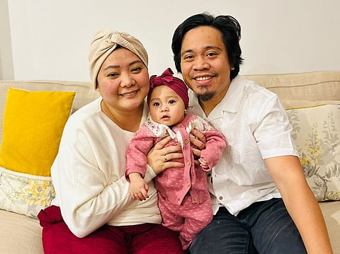 Rubelle Banguis with her husband and baby girl after a challenging journey to motherhood.