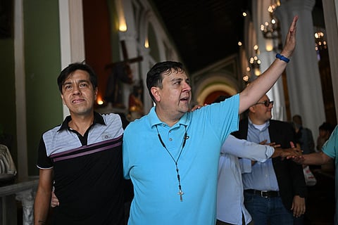 Human rights activist Javier Tarazona (R) walks with his brother Jose Rafael Tarazona (L) after his release from prison at La Candelaria church in Caracas on February 1, 2026.