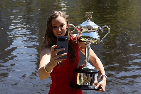 Kazakhstan's Elena Rybakina poses with the 2026 Australian Open winner's trophy on the bank of the Yarra river in Melbourne on February 1, 2026, following her victory over Belarus's Aryna Sabalenka in the women's singles final of the tennis tournament.