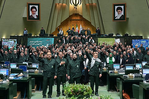 Members of Iran's parliament dressed in IRGC uniforms, chant "Death to America" during a session in Tehran on February 1, 2026,