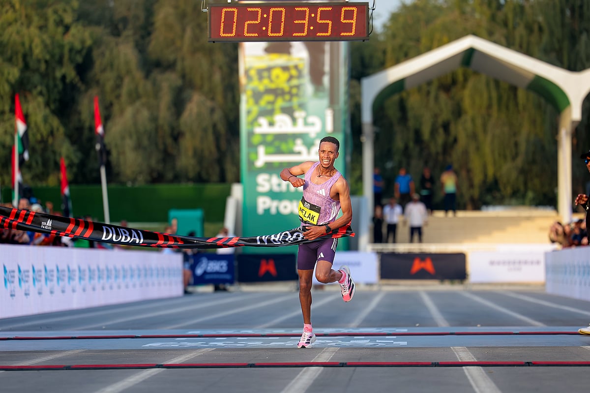 Nibret Melak from Ethiopia wins the 25th anniversary edition of the Dubai marathon. 