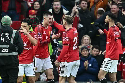 Teammates celebrate with Manchester United's Slovenian striker Benjamin Sesko 