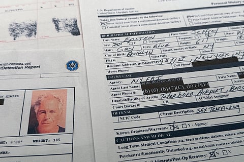 A document that was included in the U.S. Department of Justice release of the Jeffrey Epstein files is photographed Sunday, Feb. 1, 2026, shows the report when Epstein was taken into custody on July 6, 2019. (AP Photo/Jon Elswick)