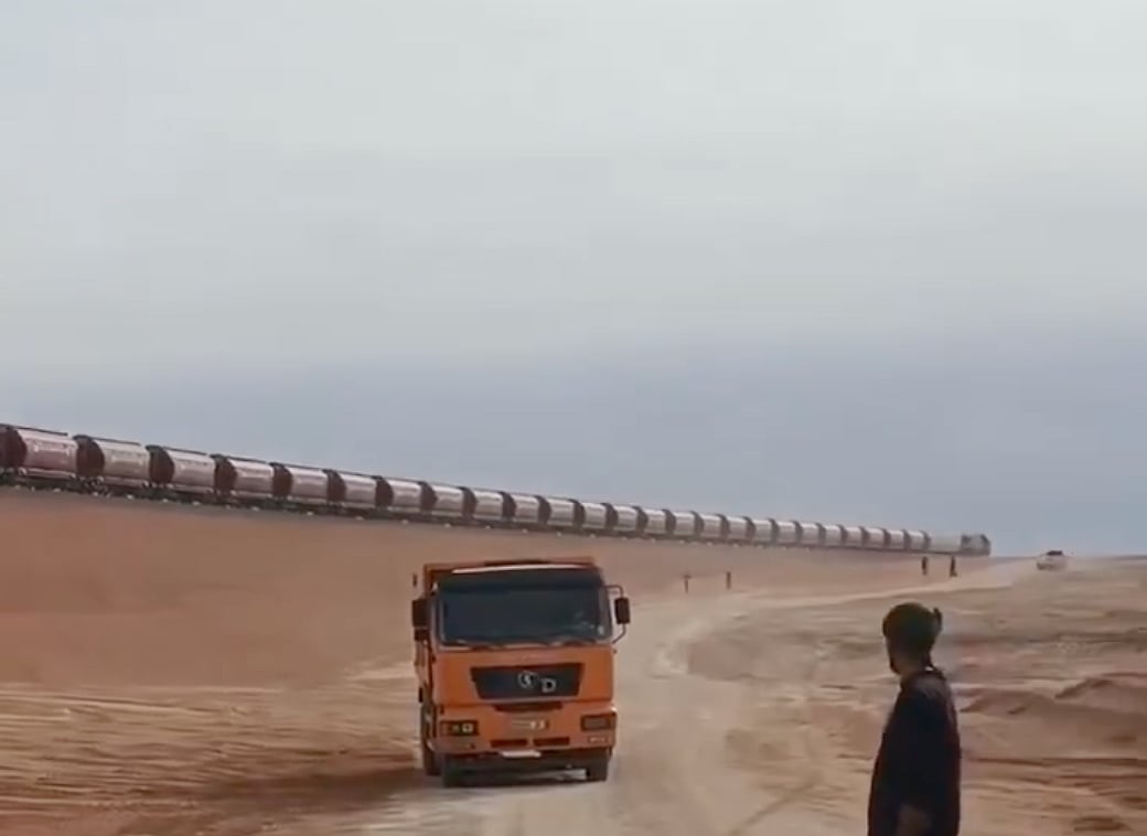 A view of Algeria's desert railway, financed by the Algerian state and partly built by a Chinese consortium. It transports iron ore from a giant mine in the Gara Djebilet deposit in the south to the city of Bechar located 950 km north, to be taken to a steel production plant near Oran further north.