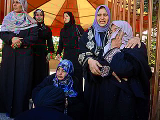 Mourners weep during the funeral of Palestinians, who were reportedly killed by an Israeli air strike, in Khan Yunis, southern Gaza Strip on January 31, 2026.