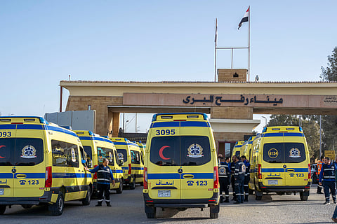 Ambulances line up to enter the Egyptian gate of the Rafah crossing on the way to the Gaza Strip, in Rafah, Egypt, Sunday, February 1, 2026.  