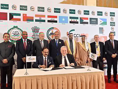 A historic moment as dignitaries from India and the Arab nations witness the signing ceremony. Backed by the flags of the member nations, the event marked a unified commitment to economic cooperation.