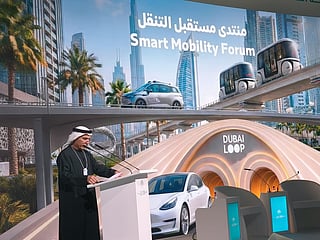 RTA Chief Mattar Al Tayer speaks at the World Government Summit, with The Loop and other smart mobility solutions displayed on the screen behind him. 
