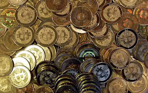 Bitcoin tokens are seen on April 3, 2013, in Sandy, Utah. (AP Photo/Rick Bowmer, File)
