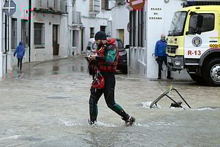 Emergency personnel get ready to carry out a total evacuation of the town of Grazalema, southern Spain, on February 5, 2026, amid Storm Leonardo.
