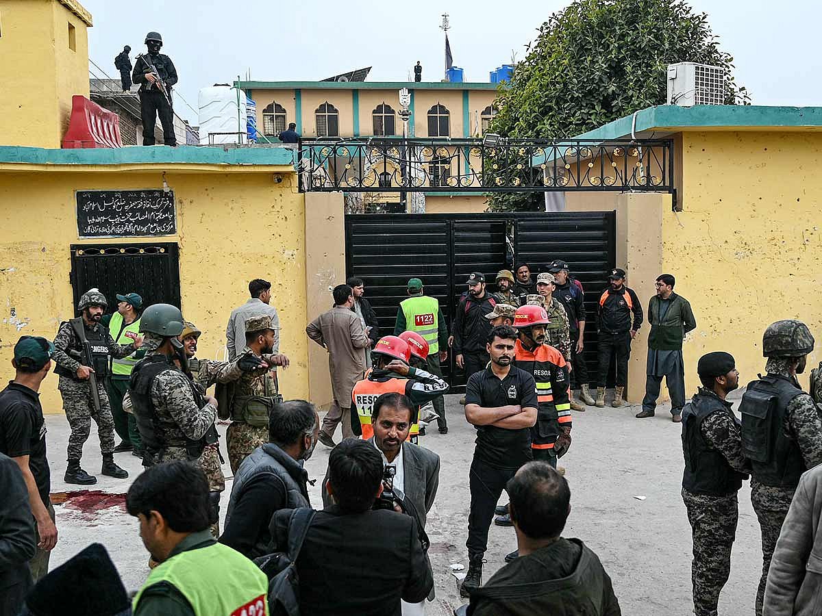 Security personnel stand guard outside a mosque following an explosion, in Islamabad on February 6, 2026. 