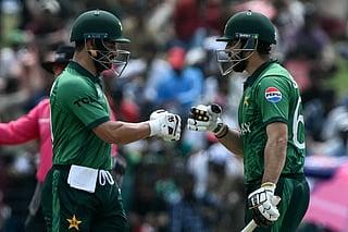 Pakistan's captain Salman Agha (R) and Sahibzada Farhan bump their fists during the 2026 ICC Men's T20 Cricket World Cup group stage match between Pakistan and Netherlands at the Sinhalese Sports Club (SSC) Ground in Colombo on February 7, 2026.