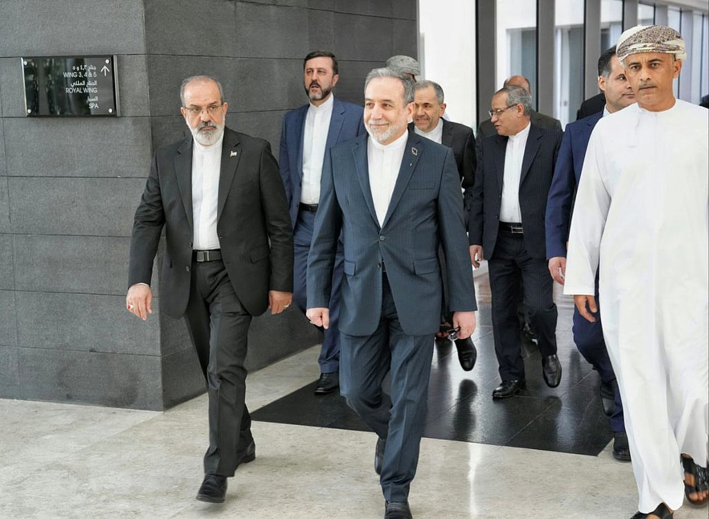 In this photo released by the Iranian Foreign Ministry, Iranian Foreign Minister Abbas Araghchi, center, heads to venue for talks between Iran and the U.S., in Muscat, Oman, Friday, Feb. 6, 2026.