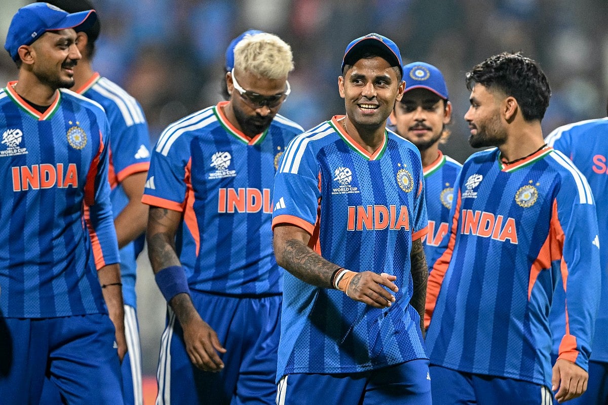 India's captain Suryakumar Yadav (C) and his teammates walk off the field after winning the 2026 ICC Men's T20 Cricket World Cup group stage match against USA at the Wankhede Stadium in Mumbai on February 7, 2026.
