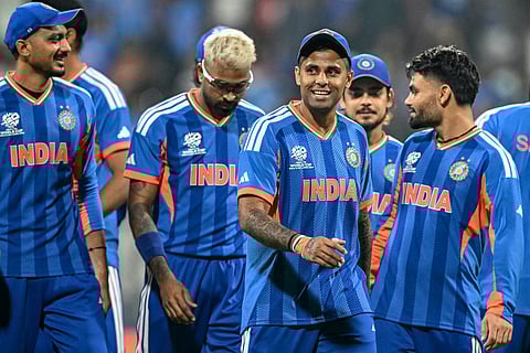 India's captain Suryakumar Yadav (C) and his teammates walk off the field after winning the 2026 ICC Men's T20 Cricket World Cup group stage match against USA at the Wankhede Stadium in Mumbai on February 7, 2026.