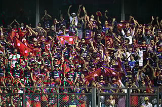 Nepal's fans cheer from the stands during the 2026 ICC Men's T20 Cricket World Cup group stage match between England and Nepal at the Wankhede Stadium in Mumbai on February 8, 2026.