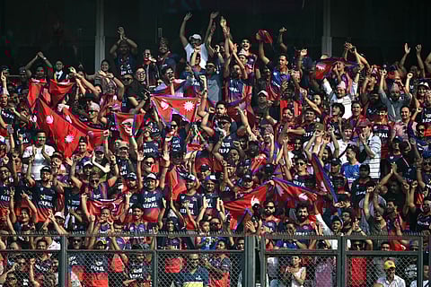Nepal's fans cheer from the stands during the 2026 ICC Men's T20 Cricket World Cup group stage match between England and Nepal at the Wankhede Stadium in Mumbai on February 8, 2026.