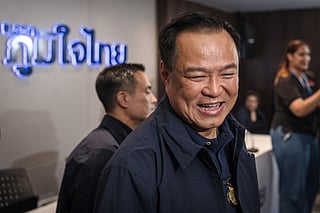 Thailand's Prime Minister and Bhumjaithai Party leader Anutin Charnvirakul reacts after a press conference while awaiting final results in Thailand's general election in Bangkok on February 8, 2026.