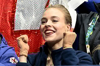 Georgia's Anastasiia Gubanova reacts in the kiss and cry area after competing in the figure skating women's singles free skating team event during the Milano Cortina 2026 Winter Olympic Games at Milano Ice Skating Arena in Milan on February 8, 2026.