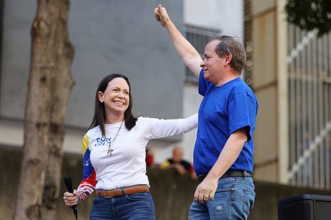 Former Deputy of the National Assembly of Venezuela, Juan Pablo Guanipa (R), gestures next to Venezuelan opposition leader Maria Corina Machado during a protest called by the opposition on the eve of the presidential inauguration in Caracas. File photo taken on January 9, 2025.