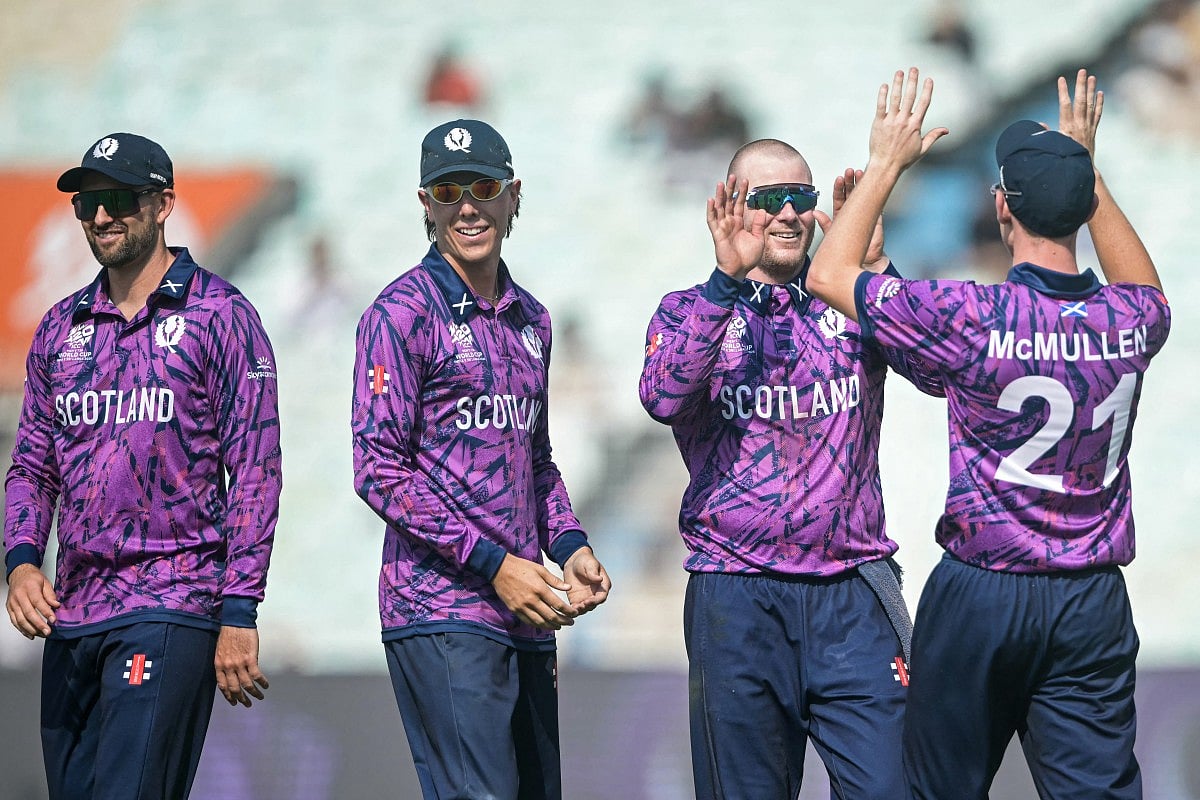 Scotland's Michael Leask (2R) celebrates with teammates after taking the wicket of Italy's Grant Stewart during the 2026 ICC Men's T20 Cricket World Cup group stage match between Scotland and Italy at the Eden Gardens in Kolkata on February 9, 2026.