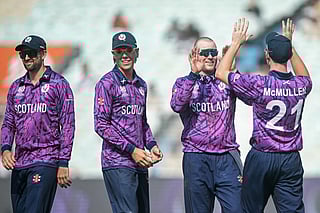 Scotland's Michael Leask (2R) celebrates with teammates after taking the wicket of Italy's Grant Stewart during the 2026 ICC Men's T20 Cricket World Cup group stage match between Scotland and Italy at the Eden Gardens in Kolkata on February 9, 2026.