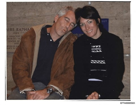 This undated photo provided by the US Justice Department on December 19, 2025 shows Jeffrey Epstein, a wealthy US financier who died in jail in 2019 while awaiting trial for sex trafficking underage girls, and his associate, Ghislaine Maxwell in an unidentified location.