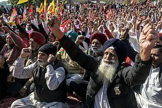 Farmers and trade union workers shout slogans during a nationwide strike over government policies and other issues in Amritsar on February 12, 2026.