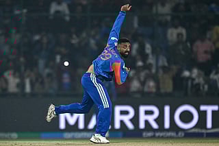 India's Varun Chakravarthy delivers a ball.