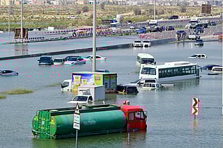 Cars are stranded on a flooded street in Dubai following heavy rains on April 18, 2024.