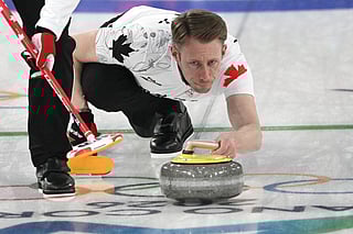 Canada's Marc Kennedy competes in the curling men's round robin between Switzerland and Canada during the Milano Cortina 2026 Winter Olympic Games 