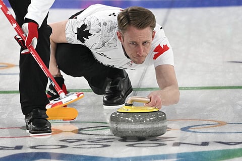 Canada's Marc Kennedy competes in the curling men's round robin between Switzerland and Canada during the Milano Cortina 2026 Winter Olympic Games 