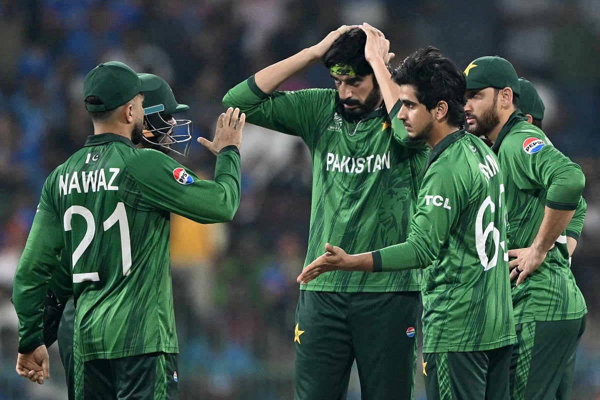 Pakistan's Saim Ayub (R) celebrates with teammates after taking the wicket of India's Tilak Varma during the 2026 ICC Men's T20 Cricket World Cup group stage match between India and Pakistan at the R Premadasa Stadium in Colombo on February 15, 2026.