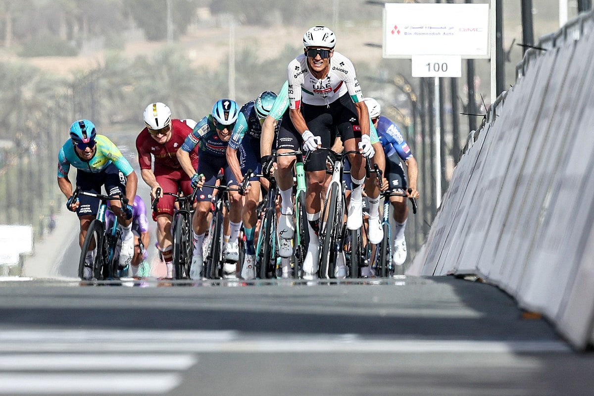 UAE Team Emirates's Mexican rider Isaac Del Toro Romero leads the pack while approaching the finish line during the first stage of the UAE Tour cycling event from Madinat Zayed Majlis to Liwa Palace in Abu Dhabi on February 16, 2026.