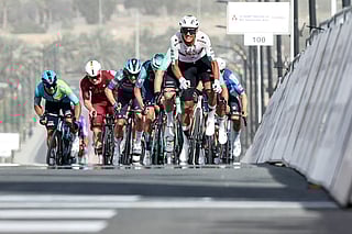 UAE Team Emirates's Mexican rider Isaac Del Toro Romero leads the pack while approaching the finish line during the first stage of the UAE Tour cycling event from Madinat Zayed Majlis to Liwa Palace in Abu Dhabi on February 16, 2026.