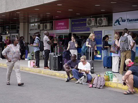Passengers wait for their delayed flights at Jomo Kenyatta International Airport (JKIA) in Nairobi, Kenya, Monday, Feb. 16, 2026. 