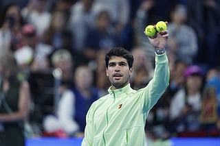 Spain’s Carlos Alcaraz celebrates after defeating France's Arthur Rinderknech during their men’s singles match at the Qatar Open tennis tournament in Doha on February 17, 2026.