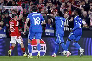 SL Benfica's Argentine forward #25 Gianluca Prestianni (L) is pictured next to Real Madrid's Brazilian forward #07 Vinicius Junior who later complained about alleged racists insults during the UEFA Champions League knockout round play-off first leg football match between SL Benfica and Real Madrid CF at Estadio da Luz in Lisbon on February 17, 2026.