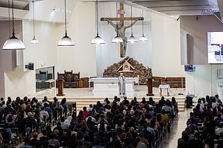 Catholics attend a mass to mark the beginning of Lent