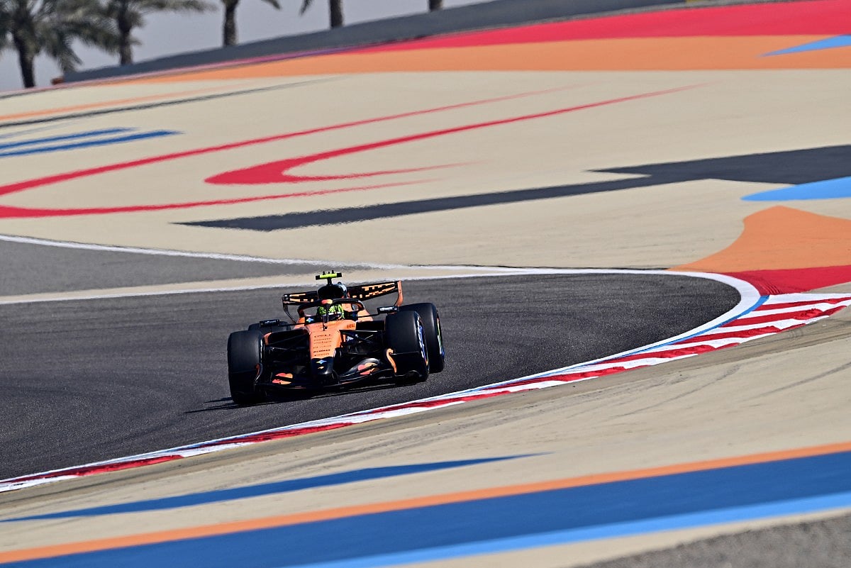 McLaren's British driver Lando Norris driver Charles Leclerc drives on the first day of the Formula One pre-season testing at the Bahrain International Circuit in Sakhir on February 18, 2026.
