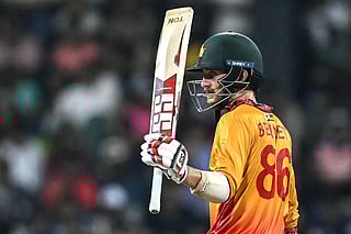 Zimbabwe's Brian Bennett celebrates after scoring a half-century (50 runs) during the 2026 ICC Men's T20 Cricket World Cup group stage match between Sri Lanka and Zimbabwe at the R Premadasa Stadium in Colombo on February 19, 2026.