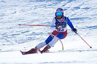 Philippine's Tallulah Proulx speeds down the course during an alpine ski, women's slalom race, at the 2026 Winter Olympics, in Cortina d'Ampezzo, Italy, Wednesday, Feb. 18, 2026