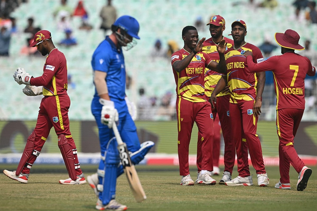 West Indies' players celebrate after the dismissal of Italy's captain Harry Manenti during the 2026 ICC Men's T20 Cricket World Cup group stage match between West Indies and Italy at the Eden Gardens in Kolkata on February 19, 2026.