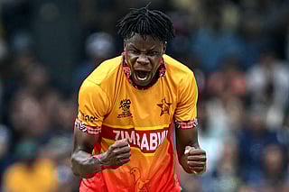 Zimbabwe's Blessing Muzarabani celebrates after taking the wicket of Sri Lanka's Kusal Perera during the 2026 ICC Men's T20 Cricket World Cup group stage match between Sri Lanka and Zimbabwe at the R Premadasa Stadium in Colombo on February 19, 2026.