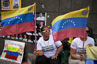 People who consider their detained family members to be political prisoners protest for their releases outside the United Nations office in Caracas, Venezuela, Wednesday Feb. 18, 2026.