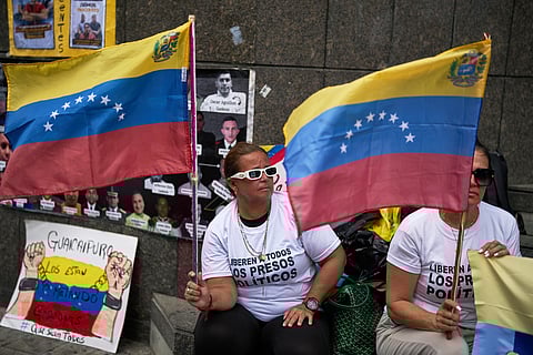 People who consider their detained family members to be political prisoners protest for their releases outside the United Nations office in Caracas, Venezuela, Wednesday Feb. 18, 2026.
