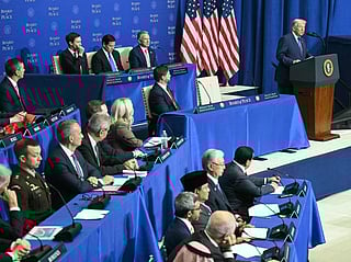 US President Donald Trump (R) delivers remarks during the inaugural meeting of the "Board of Peace" at the US Institute of Peace in Washington, DC, on February 19, 2026.