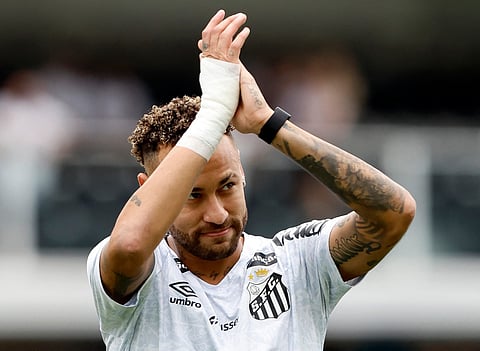 Santos' froward #10 Neymar greets fans during a tribute for scoring 150 goals for the club, before the Brasileirao Serie A football match between Santos and Cruzeiro at the Urbano Caldeira Stadium in Santos, Sao Paulo state, Brazil on December 7, 2025.