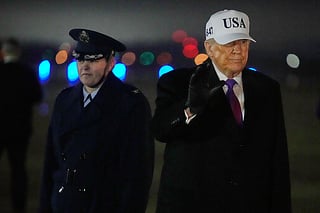President Donald Trump waves after stepping off Air Force One, Thursday, Feb. 19, 2026, at Joint Base Andrews, Md., on return from a trip to Georgia.