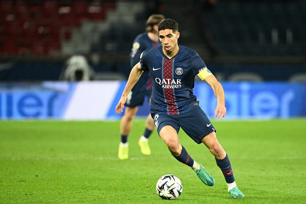 Paris Saint-Germain's Moroccan defender Achraf Hakimi runs with the ball during the French L1 football match between Paris Saint-Germain (PSG) and FC Metz at the Parc des Princes stadium in Paris on February 21, 2026.